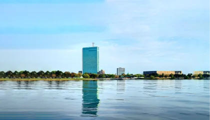 Lake Charles waterfront with a teal glass tower
