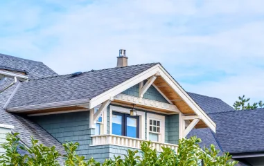 Craftsman house with gray shingles and teal siding