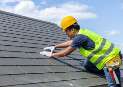Roof,Repair,,Worker,With,White,Gloves,Replacing,Gray,Tiles,Or
